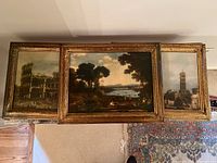 Top view showing all three framed paintings aligned horizontally on a surface.