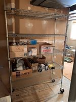 Front view of chrome wire shelving unit with contents removed