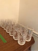 Front row of twelve crystal highball tumblers in a diagonal line