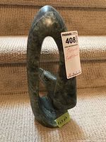 Front view showing full oval form and eagle head inside