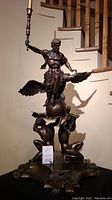 Front view of entire sculpture including base and candle holder