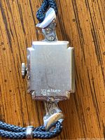 Back case of Gruen wristwatch showing 14K marking indicating 14 karat gold.