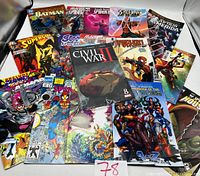 Overview of 17 comic books from Marvel, DC, and Continuity Comics laid out showing various superheroes and titles.