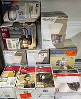 Overview of lighting collection boxes displaying brands, product types, and packaging