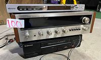 Front view showing the Pioneer SX-525 stereo receiver with its silver panel and wooden sides, the Memorex DVD player on top and the Emerson VHS player below.