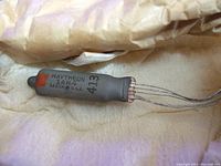 Close-up of Raytheon 1AH4 tube showing model number, brand and origin