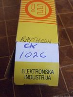 Box labeled 'Raytheon CK 1026 ELEKTRONSKA INDUSTRIJA' with handwritten marking showing the product name and manufacturer.