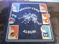 Vintage hockey card album with NHL team logos on cover, worn edges and scratches