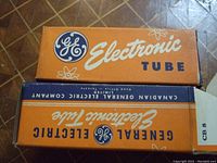Photo of two General Electric Electronic Tube boxes, orange and blue color, labeled General Electric and Canadian General Electric Company Limited