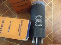 Close-up of single 1P5M tube marked Made in Canada with original Canadian General Electric box visible