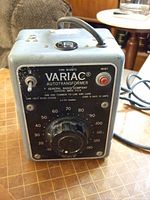 Front view of old Variac autotransformer showing dial, toggle switch, reset button, and voltage markings from 0 to 140 volts.