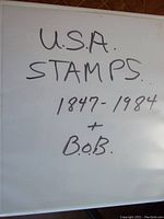 Handwritten lot title on album cover reading 'U.S.A. Stamps 1847-1984 + B.O.B.'