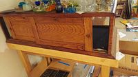 Front view of oak wood display box with sliding doors