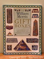 Front cover of the vintage book titled 'The William Morris Gift Boxes' featuring images of various folded box designs, including pyramids and rectangular boxes, with floral patterns.