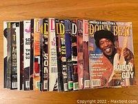Photo showing a collection of 21 vintage jazz and blues magazines, mostly Down Beat and Jazz Times, from the 1990s and 2000s featuring various covers and artists.