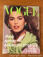Front cover showing Cindy Crawford with green earrings and lime green text logo 'VOGUE'. Cover also reads 'think spring AMERICAN STYLE '88'