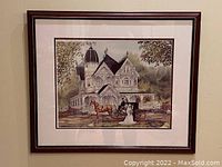 Framed print showing full artwork and frame detail, depicting Victorian house with horse-drawn carriage and bride and groom