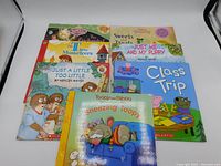 Set of seven colorful children's picture story books arranged in two rows, showing full cover art and titles.