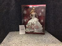 Front view of the 2008 Holiday Barbie doll in original sealed box with the doll visible inside wearing a white and silver gown.