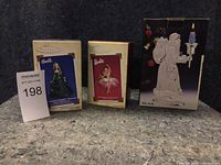 Two Barbie Keepsake ornaments and Santa candle holder in original boxes