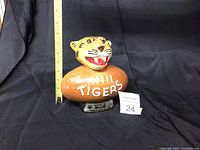 Front view of the Jim Beam Tigers decanter showing tiger head and football body with 'The Tigers' text.