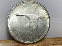 Obverse side with flying Canada goose and date 1867-1967