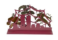 Front view of red metal laser sculpture featuring Spider-Man, Venom, and Carnage characters integrated into spider web and city skyline base.