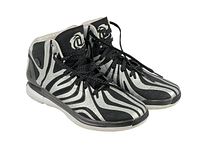 Left side and front view of Adidas Dwyane Wade basketball shoe showing zebra stripe design and logo details.