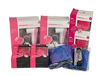 Photo showing whole lot with two boxed TouchBeauty 4-in-1 skincare devices, two boxed facial cleansing brushes, two packs of pink massage rollers, and two blue mesh pouches.