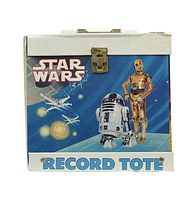 Front view of the record tote case showing R2-D2 and C-3PO with space background and X-wing fighters, 'STAR WARS' and 'RECORD TOTE' branding.