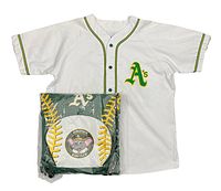 Front view of vintage Oakland A's white baseball jersey with Kids Club backpack still in packaging
