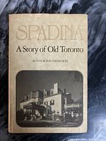 Front cover of vintage book 'Spadina A Story of Old Toronto' showing title and sepia photograph of old building.