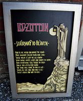 Framed three-dimensional Led Zeppelin wall plaque with sculpted figure holding lantern, displaying "Stairway to Heaven" lyrics on black background.