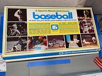 Top cover of the Sports Illustrated Baseball board game box showing title, photos, and game details