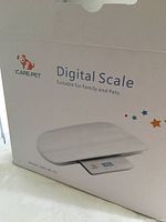 Box of ICare-Pet Digital Scale showing front with product image and branding, indicating use for family and pets.