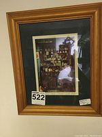 Framed print "The Irish Dresser" in wooden frame with dark green matte, showing full front view of art and frame.