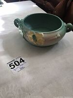 Green Roseville Poppy bowl with scroll handles, showing overall shape and marks
