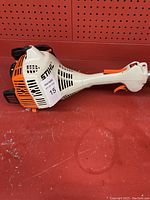 Close-up of engine housing showing STIHL logo and model sticker.