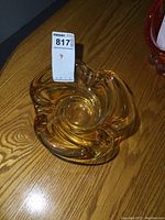 Top view showing swirled shape and amber tone with smooth surface