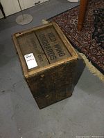 Top and sides view of the wooden crate showing stenciled text 'RED WING ORCHARDS WHITBY ONT'