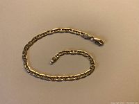 Bracelet laid out on grey background
