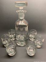 Full set showing decanter with stopper and six glasses arranged around it