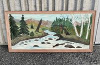 Framed full view of the landscape oil painting showing river, trees, and mountains.