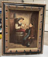 Frontal view of framed oil painting depicting two men sampling wine.