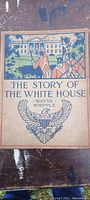 Front cover of the antique book showing title, author Wayne Whipple, and illustration of the White House with soldiers