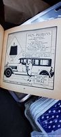Photo of an illustrated page from 1925 Peerless automotive catalog showing car drawing, original prices, and specs.