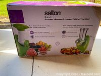 Photo of Salton 3-in-1 frozen dessert maker/slicer/grater packaging box showing product features and uses.