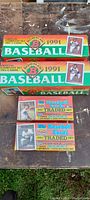 Photo of two sealed 1991 Bowman Baseball boxes and two Topps 1991 Traded sets still in original packaging showing front and side box art including Rod Carew III player images.