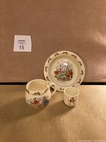 Full set photo showing bowl, mug, and small cup with rabbit illustrations and bunny border.