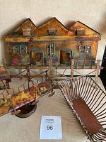 Front view of metal pier structure with detailed openings and patina finish